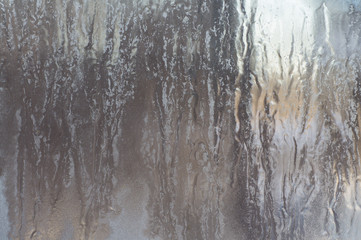 Texture of frozen glass. Light background