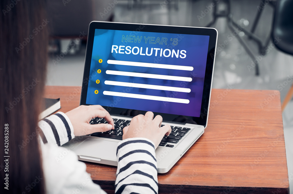 Poster Asian woman type new year  resolutions on laptop and looking at screen on table in coffee shop,Blank notebook screen mock up for display of design or content,Digital lifestyle.