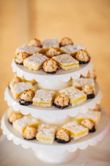 a bunch of desserts sitting on a tray for a wedding