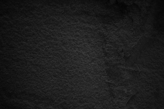 Black stone wall. Dark grey texture in natural pattern with high resolution for background and design art work.