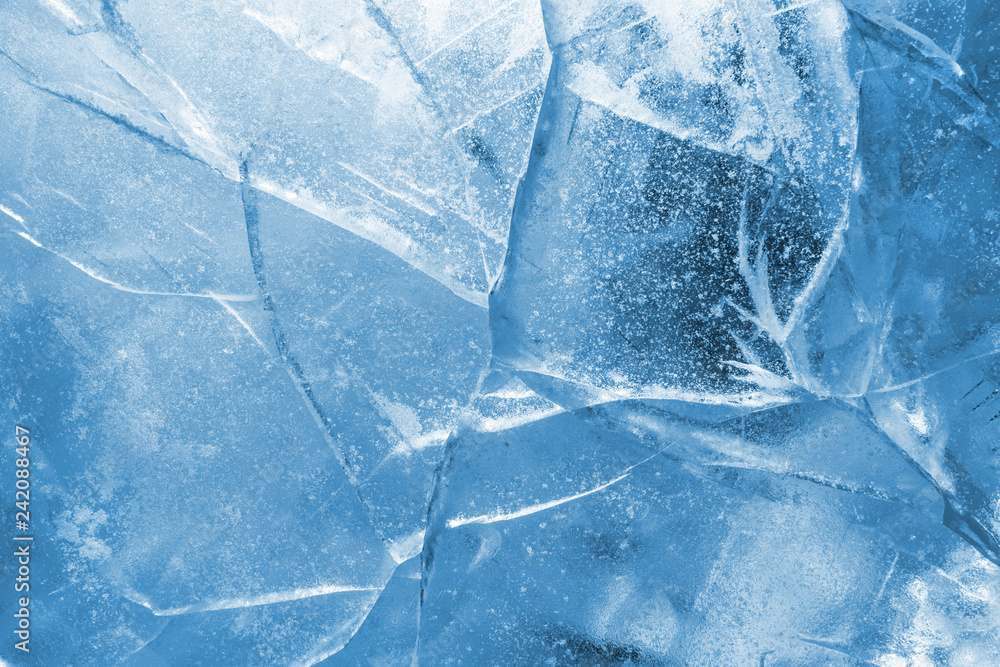 Wall mural abstract ice background. blue background with cracks on the ice surface