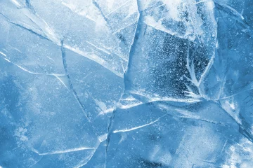 Foto op Aluminium Abstracte ijsachtergrond. Blauwe achtergrond met scheuren op het ijsoppervlak © Leonid Ikan