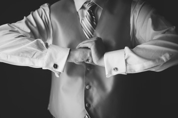 man in business attire holding fists cracking knuckles power move strong