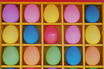Colored balls in a box. Shooting range for darts