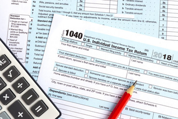 United States federal income tax return IRS 1040 documents and calculator