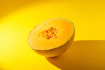 Cantaloupe on yellow background