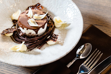 Chocolate dessert with with white chocolate petals