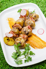 potatoes with bacon on skewers