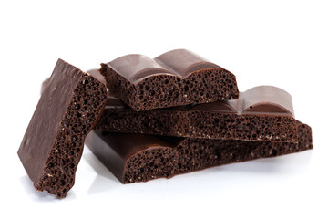 Pieces of the dark aerated chocolate close-up