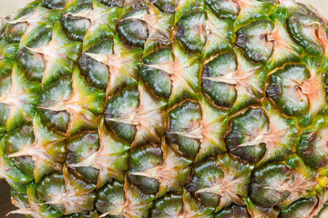 Background of skin of whole pineapple fruit close-up