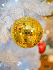 Mirror ball Christmas hanging decoration on light blue background