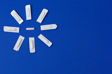 Medical Suppository, Rectal or Vaginal. Isolated on blue Background.