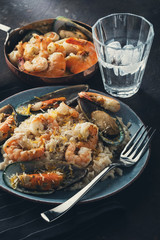 Risotto with seafood. Rice with shrimps and mussels.