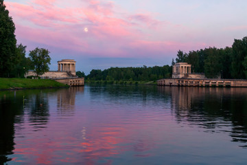 Obraz premium night landscape with the moon and the reflected sky in the river