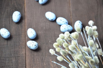Easter background with willow branches and eggs.