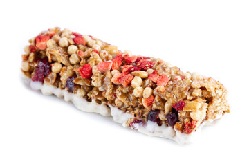 Isolated Muesli and Granola bar. Healthy, fitness, sweet dessert snack and fiber food. Cereal granola bar with fruit and berries on a white background
