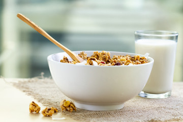 Dry breakfast cereals. Crunchy honey granola bowl with flax seeds, cranberries and coconut and a...