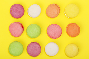 Bright background with rows of macaroons	