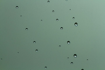 Raindrops texture. Drops on glass during rainy, wet, damp weather