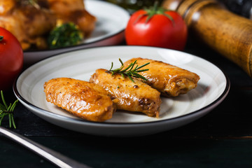 Grilled chicken wings with vegetables and herbs
