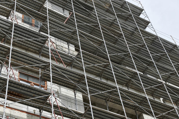 new building under construction, scaffolding and concrete