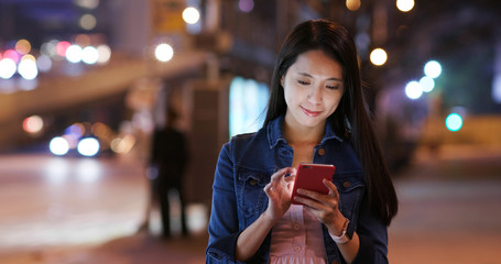 Woman use of cellphone at night