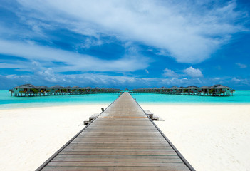 Obraz premium tropical Maldives island with white sandy beach and sea