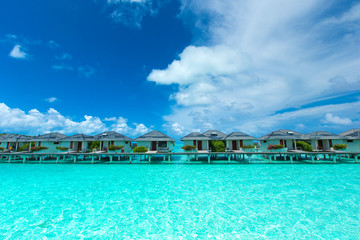 Fototapeta na wymiar Maldives water bungalow on ocean water landscape
