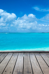tropical Maldives island with white sandy beach and sea