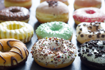 Doughnuts donuts various types of cakes abstract fat thursday concept
