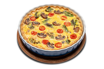 Baked homemade quiche pie in ceramic baking form
