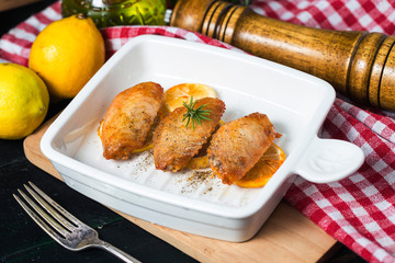 Grilled chicken wings with vegetables and herbs