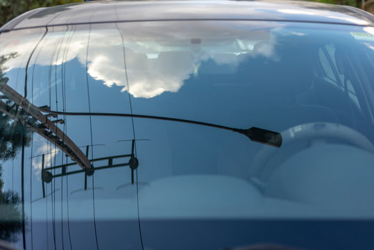 Sky reflections on a car window