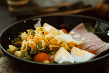 Fresh fruits salad and ham with egg