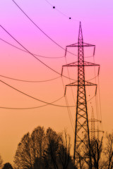 Pink orange sunset with high voltage poles