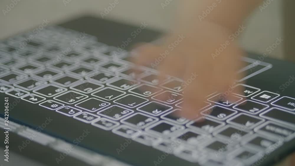 Poster baby trying to type and hit the modern computer keyboard