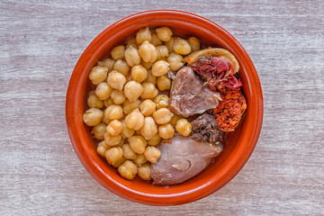 Cocido: traditional Spanish dish with chickpeas, meat and sausage.