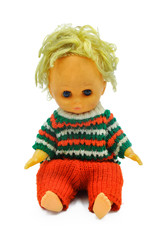 Vintage baby doll sitting on white background