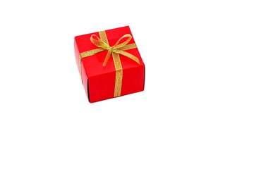 Red box with a bow of Golden ribbon. Gift. Holiday.