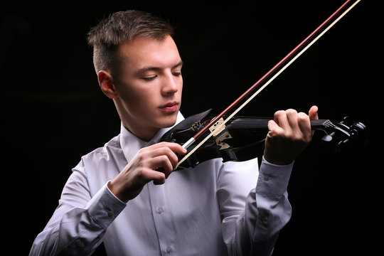 Young men playing the violin