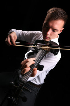 Young men playing the violin