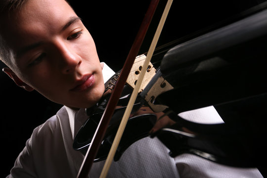 Young men playing the violin