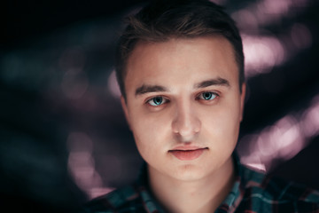 portrait of a young man on a blurred background