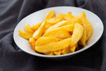 Golden French fries potatoes ready to be eaten