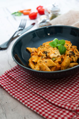 Penne gratin with vegetables, grilled zucchini and marinated tomatoes