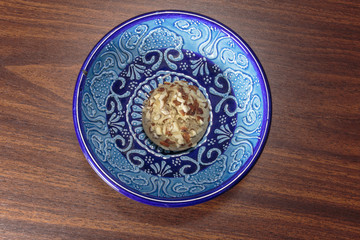 Traditional oriental ginger cookies on the wooden table.  Gingerbread with nuts, almonds, sage and saffron.