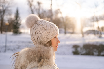 Profil close-up portrait young woman outdoors in sunny winter day © LifestyleFootage