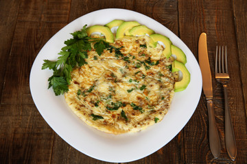 omelette with fresh parsley and avocado
