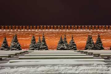The Kremlin wall. Snow-covered night red square.