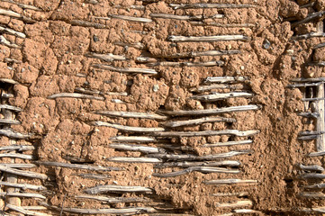 Rammed exterior wall reinforced with wooden planks - obrazy, fototapety, plakaty